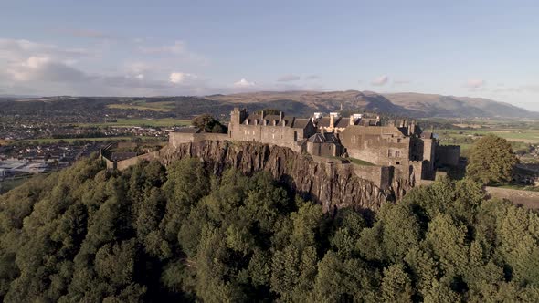 Stirling castle aerial pan and orbital shot from east to west, looking north on a bright and sunny d