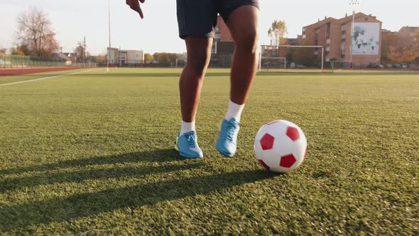 Closeup of a Legs of a Black Soccer Player Practicing Ball Possession in a Training Session