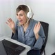 Amazed excited young blonde woman in headphones surprise looking at laptop computer with big eyes - VideoHive Item for Sale