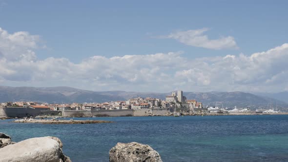 ANTIBES, FRANCE - JULY 2017  French riviera city with beautiful  blue sea and Alps in background slo