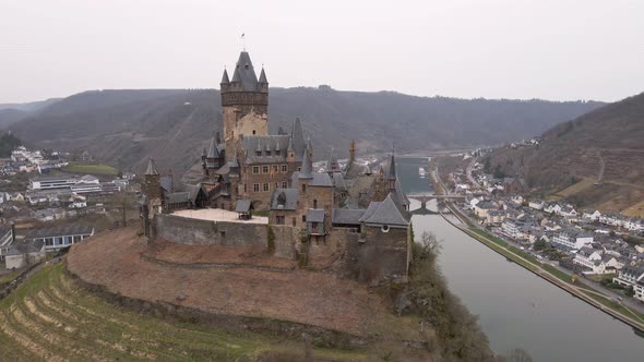 circular drone flight of the castle of cochem on the banks of the river Moselle in this incredibly b