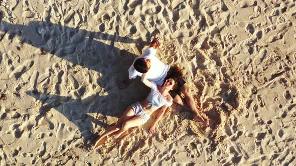 Happy Boy and Girl on Honeymoon Vacation Enjoy Life on Beach on Summer White Sandy