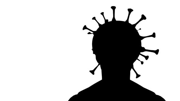 silhouette of a man and covid-19 virus in a human head
