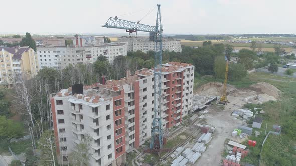 Apartment building under construction and a crane