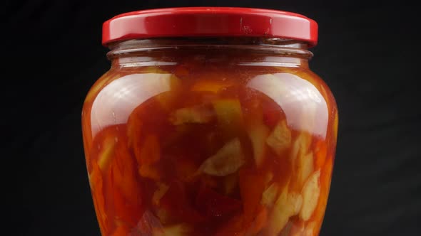 Canned vegetable lecho in a glass jar