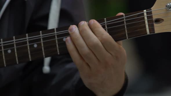 Musician Guitarist Playing Chords on Electric Guitar Close Up, Music Hobby
