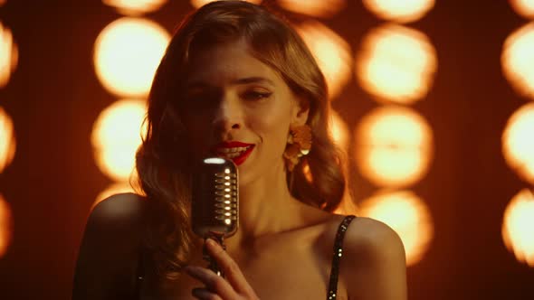 Girl Singer Singing Microphone in Nightclub Closeup