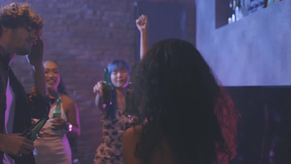 Young People Partying and Toasting a Drink at the Night Club