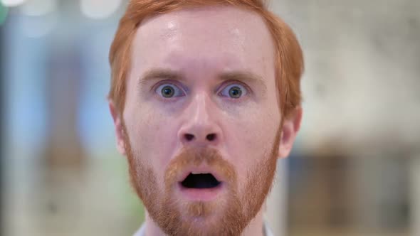 Face of Redhead Man Feeling Shocked at Camera