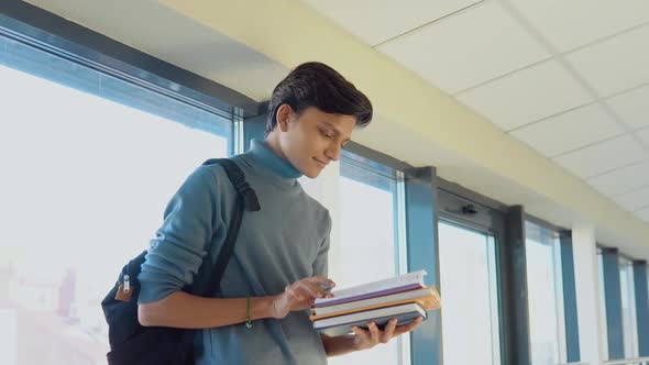 Pakistani Student with a Books in the University