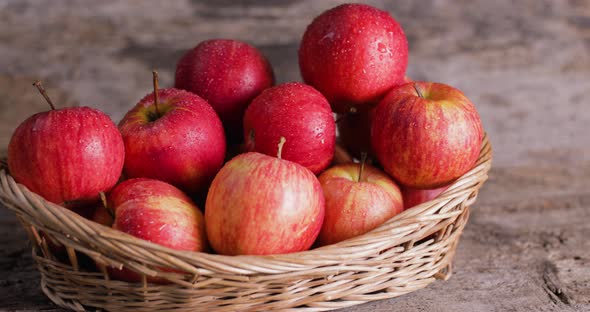 basket of red apples on a table 