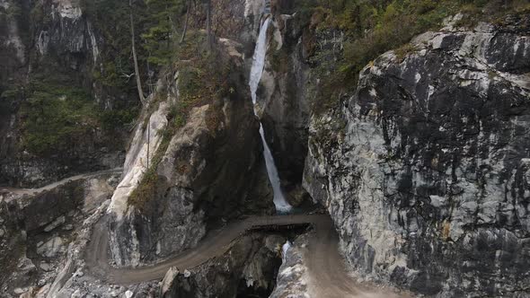 Flying in towards the Chame waterfall along winding dirt road