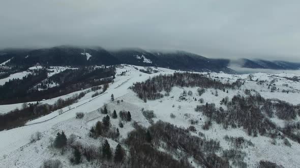 Aerial Drone View Flight Over Winter Mountain Forest