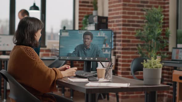 Business Woman Having Discussion with Man on Video Call