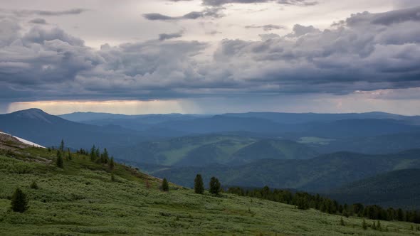 summer mountain valley with dramatic sky