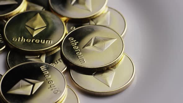 Rotating shot of Ethereum Bitcoins (digital cryptocurrency) - BITCOIN ETHEREUM 