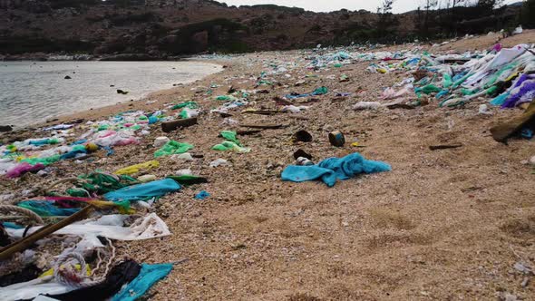 Shocking large scale beach pollution - marine debris everywhere; drone