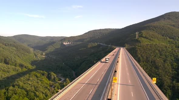 Panoramic View of Viaduct Highway Bridge Against Green Hills