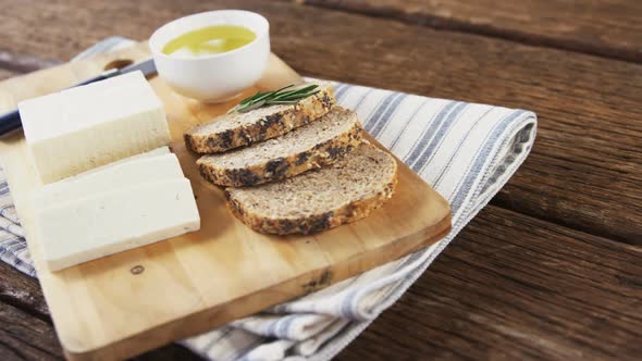 Slices of bread, cheese, sauce and knife