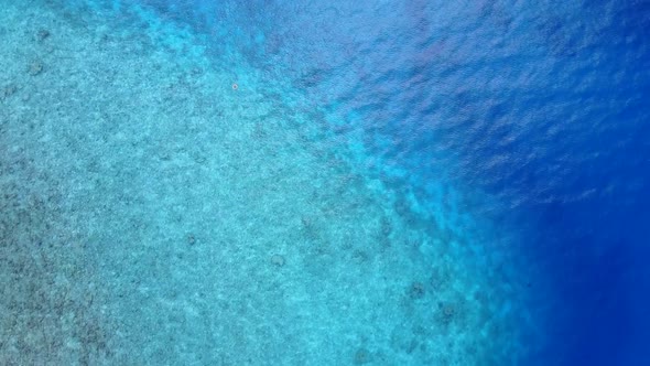 Sunny panorama of coastline beach voyage by clear ocean and sand background before sunset