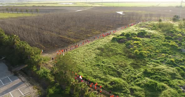 Aerial View of people running during the city marathon, Northern District.