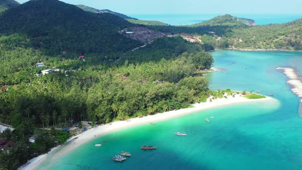 Clouds shade over the tropical sandy coast. Malibu beach, Koh Pha Ngan, Thailand. Aerial