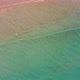 Scenic drone aerial view of the beach and ocean with calm waves during a sunset with vibrant colors. - VideoHive Item for Sale