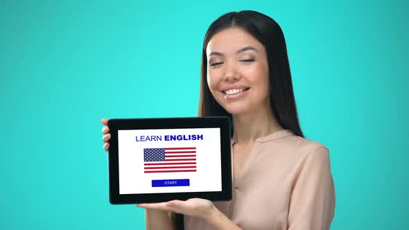 Female Holding Tablet With Learn American English Application, Ready to Start