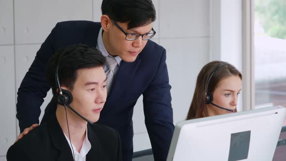 Business People Wearing Headset Working in Office