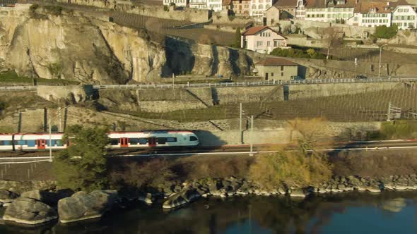 Train Goes Along Lake Geneva Shore. Vineyards. Switzerland. Aerial View