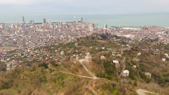 Aerial hyperlapse of beautiful church on top of the mountain in Batumi