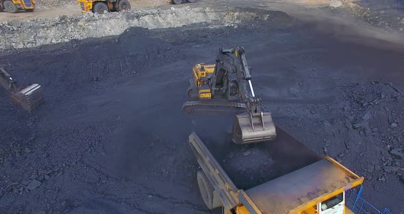 View From Copter Excavator Loads Coal Into Dump Truck