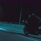 A Man Enters a Turn on a Sports Motorcycle and Picks Up Speed - VideoHive Item for Sale