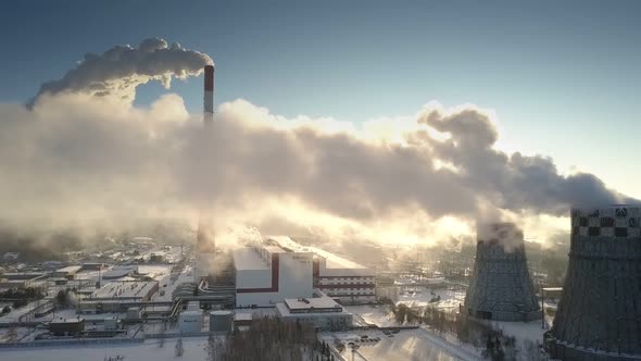 Upper View Steam Clouds Hide Morning Sun on Winter Day