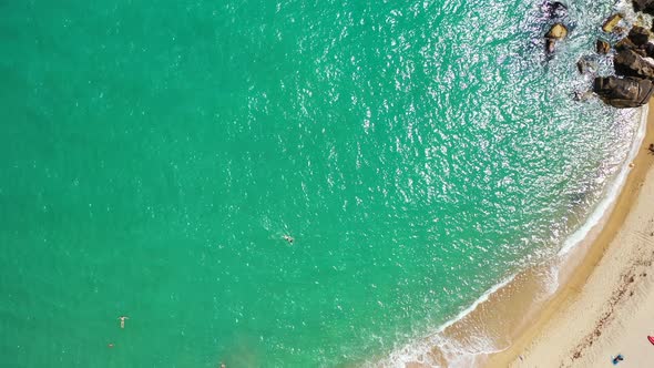 Wide overhead abstract view of a sandy white paradise beach and turquoise sea background in high res