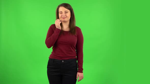 Pretty Girl Smiling and Blowing Kiss. Green Screen