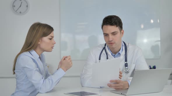 Doctor Telling Sad News About Disease To Patient, Medical Report