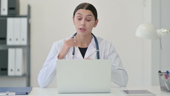 Female Doctor Talking on Video Chat on Laptop 