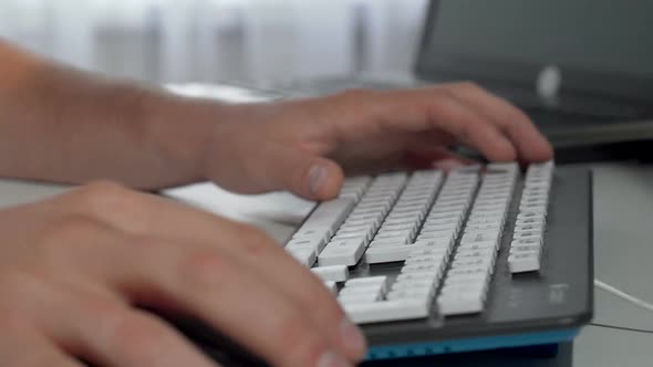 Male Hands Typing on Computer Keyboard