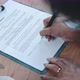Hands of a young woman signing conract close up shot - VideoHive Item for Sale
