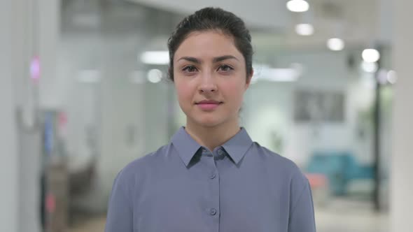 Portrait of Young Indian Woman Looking Towards Camera