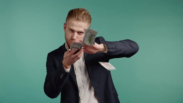 Businessman with Happy Face Scatters Money