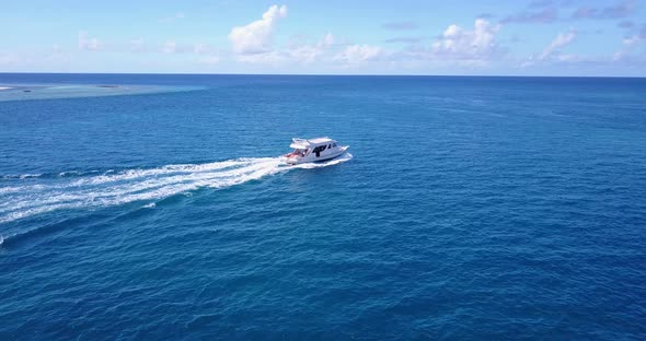 Luxury overhead clean view of a paradise sunny white sand beach and blue ocean background 