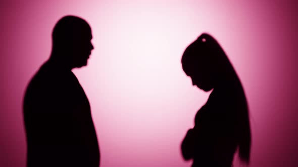 Man Shouting on Woman Quarrelling on Pink Background