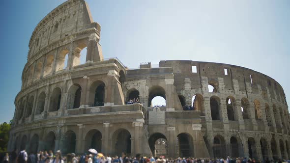 Tourists Walking Near Ancient Amphitheater Coliseum in Italy, Enjoying Tour