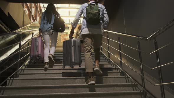 Couple of the Travellers on the Steps at the Hall of Station