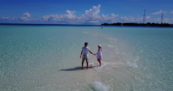 Beautiful people married on vacation enjoy luxury on beach on sunny white sandy 
