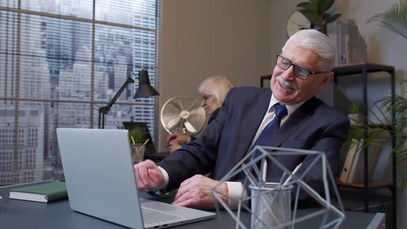 Cheerful Senior Business Company Manager Working on Laptop Laughing Celebrating Win Victory