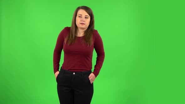 Pretty Girl Listening To Boring Information and Yawning. Green Screen