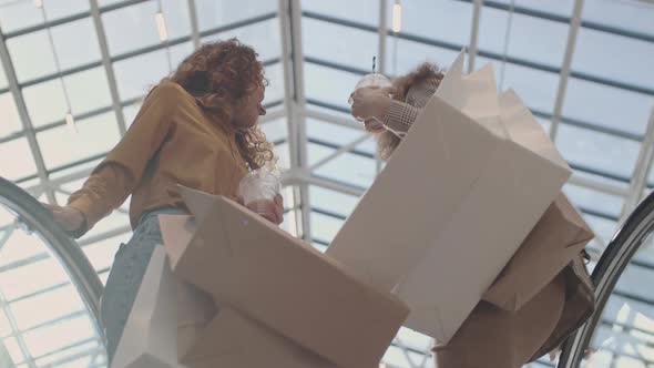 Two Cheerful Women at Way to Next Store